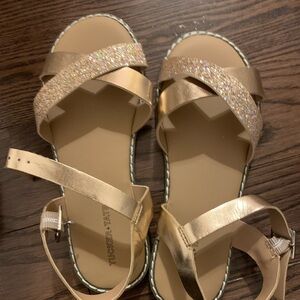 Tucker and Tate hold sparkly sandals